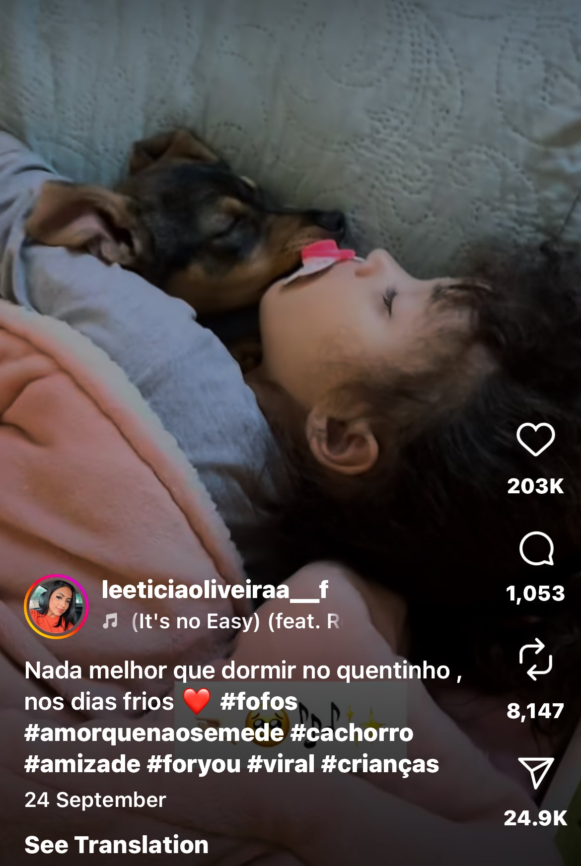 Puppy and Little Girl Sleep Side by Side in a Bed