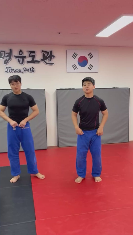 Judo Practitioners' Failed Attempt to Trip Their Teammate