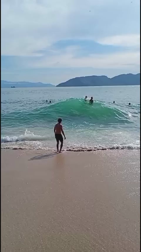 Man Gets Knocked Over by Large Wave