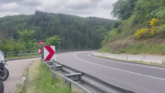 Motorcyclist Zooms Round Bend