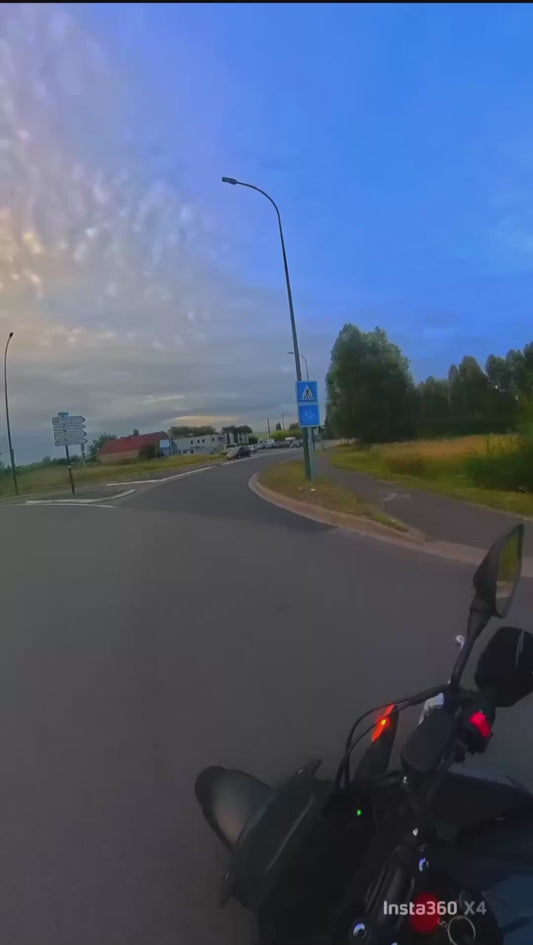 Biker Almost Gets Hit by Car at Roundabout