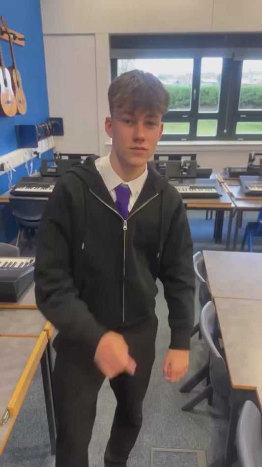 Student’s Position Remains Unchanged Despite his Friends Pulling his Chair and Desk