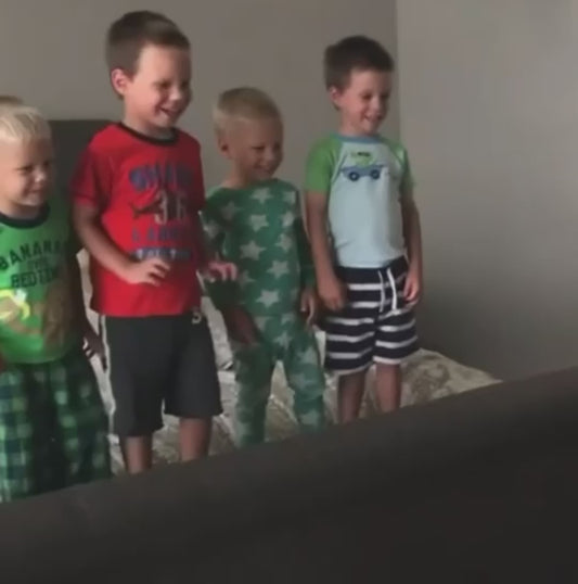 Parent Playfully Throws Pillows at Children