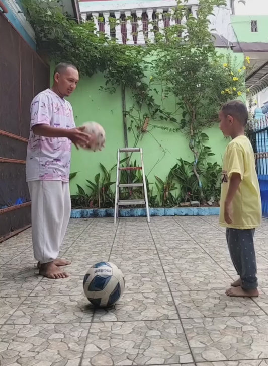 Father and Son Collide While Trying to Head a Football