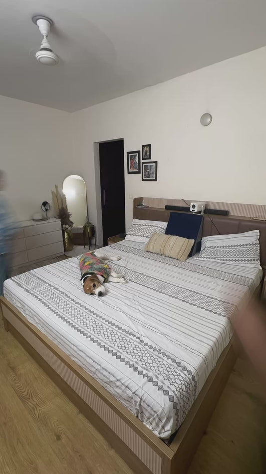 Dog 'Helps' His Owners Make the Bed