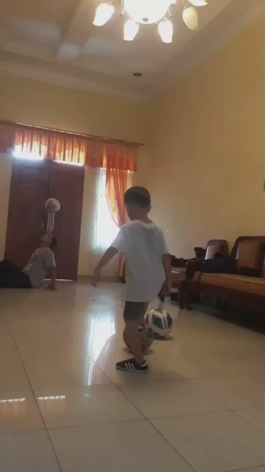 Kid Knocks Two Footballs off his Dad's Head