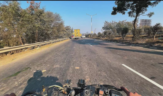 Biker Squeezes Through Tiny Gap Between Two Vehicles