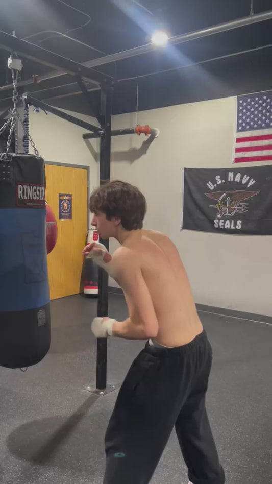 Boxer Demonstrates Unconventional Technique During Bag Work