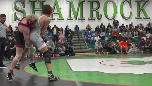 Insane Crotch Lift Sends Opponent Flying in Wrestling Match