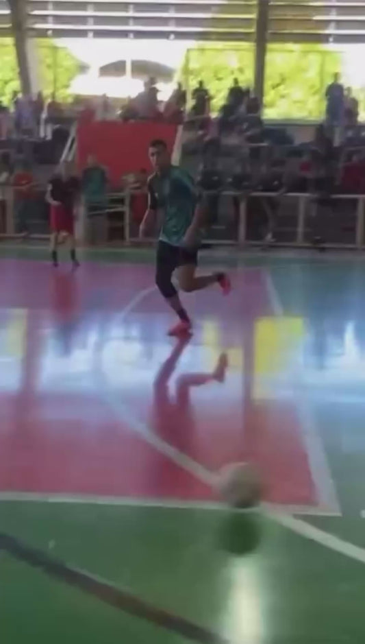 Futsal Player Dribbles Past Goalkeeper and Scores