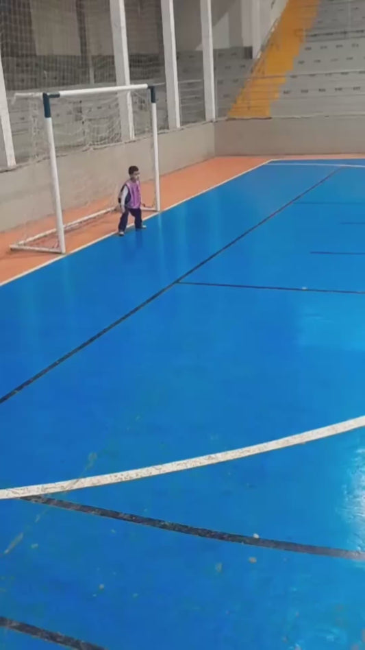 Child Goalkeeper Makes Unique Save in Futsal Game