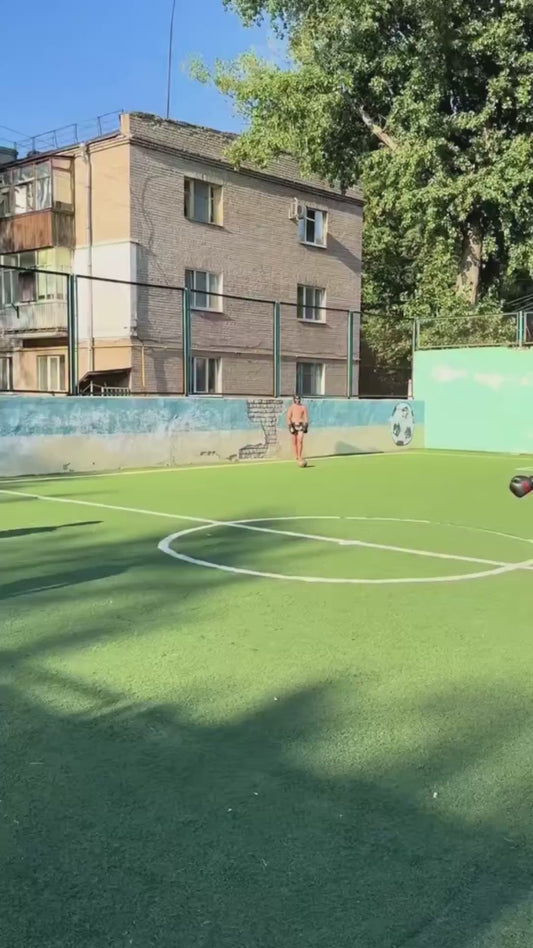 Group of Guys Play "Footbox", a Cross Between Football and Boxing