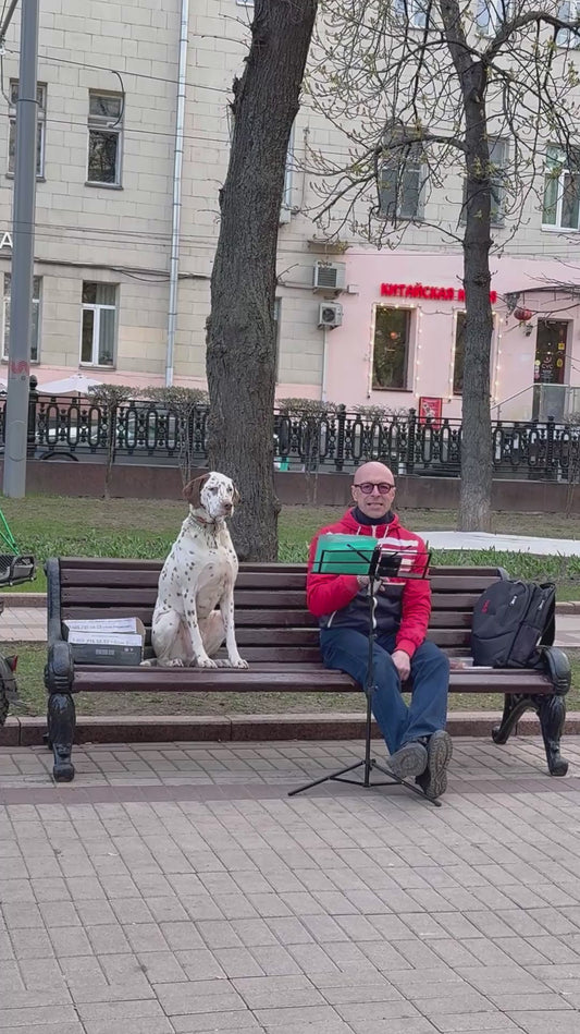Man Performs Singing Duet With a Dog