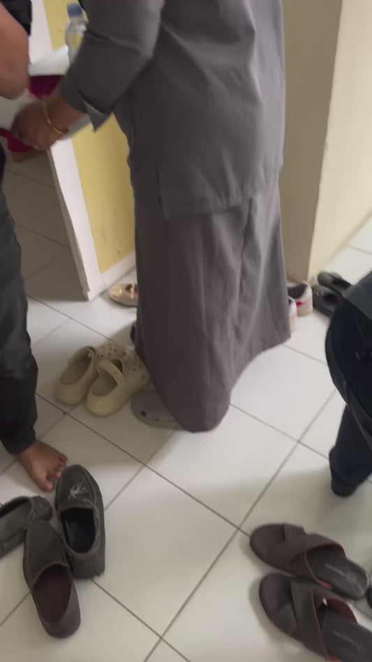 Man Hilariously Struggles to Put On Unusual Face Mask