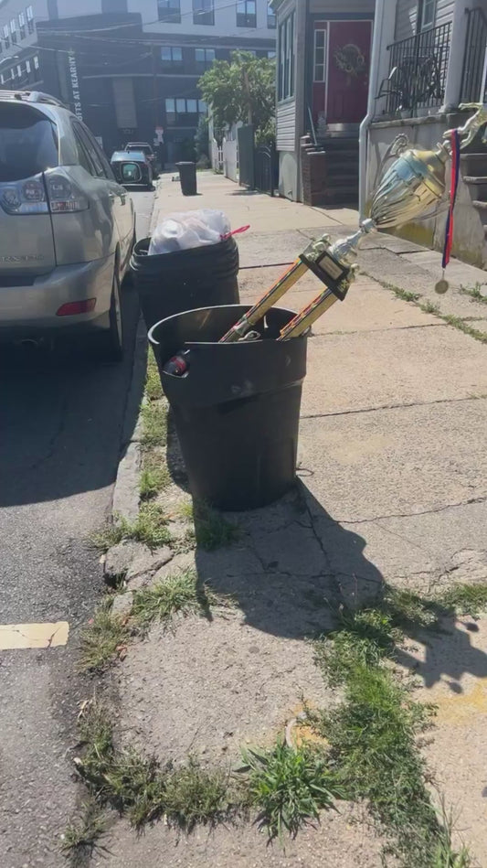 Man Finds 'Symbolic' Trophy in a Trash Can