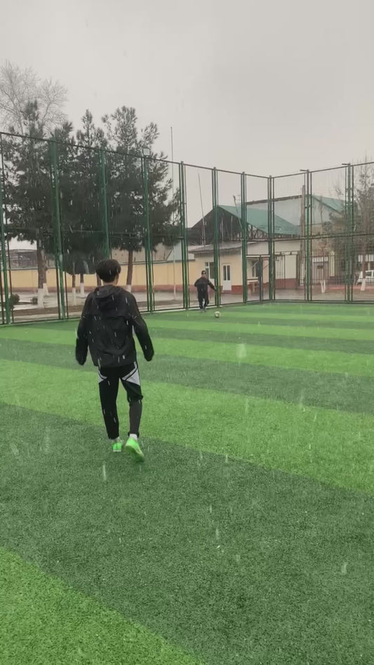 Guy Slips Over While Trying to Control Football