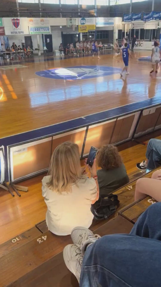 Woman Struggles to Record Video at Basketball Game