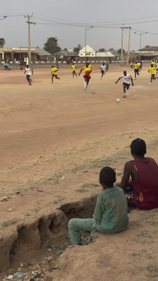 Powerful Slide Tackle in Football Match