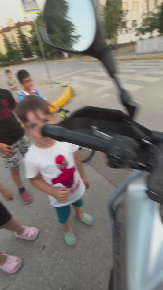 Curious Kids Attempt to Rev Motorbike