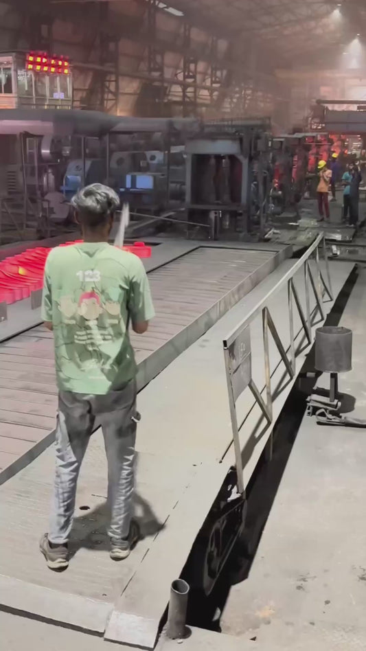 Worker Skillfully Handles Red-Hot Steel Strip (1)